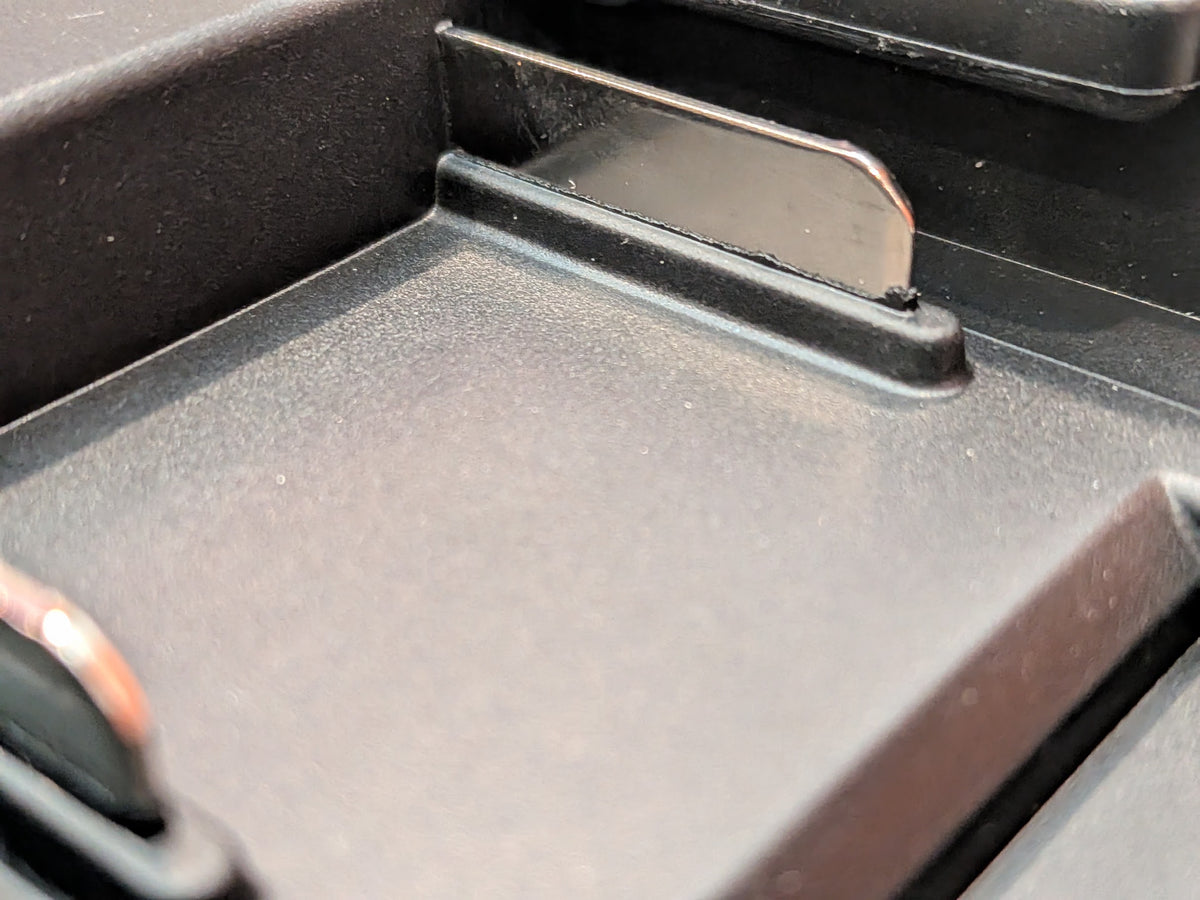 Makita 18V LXT to Bosch 18V GBA (Blue) battery adapter - close-up of a copper contact blade in the channel