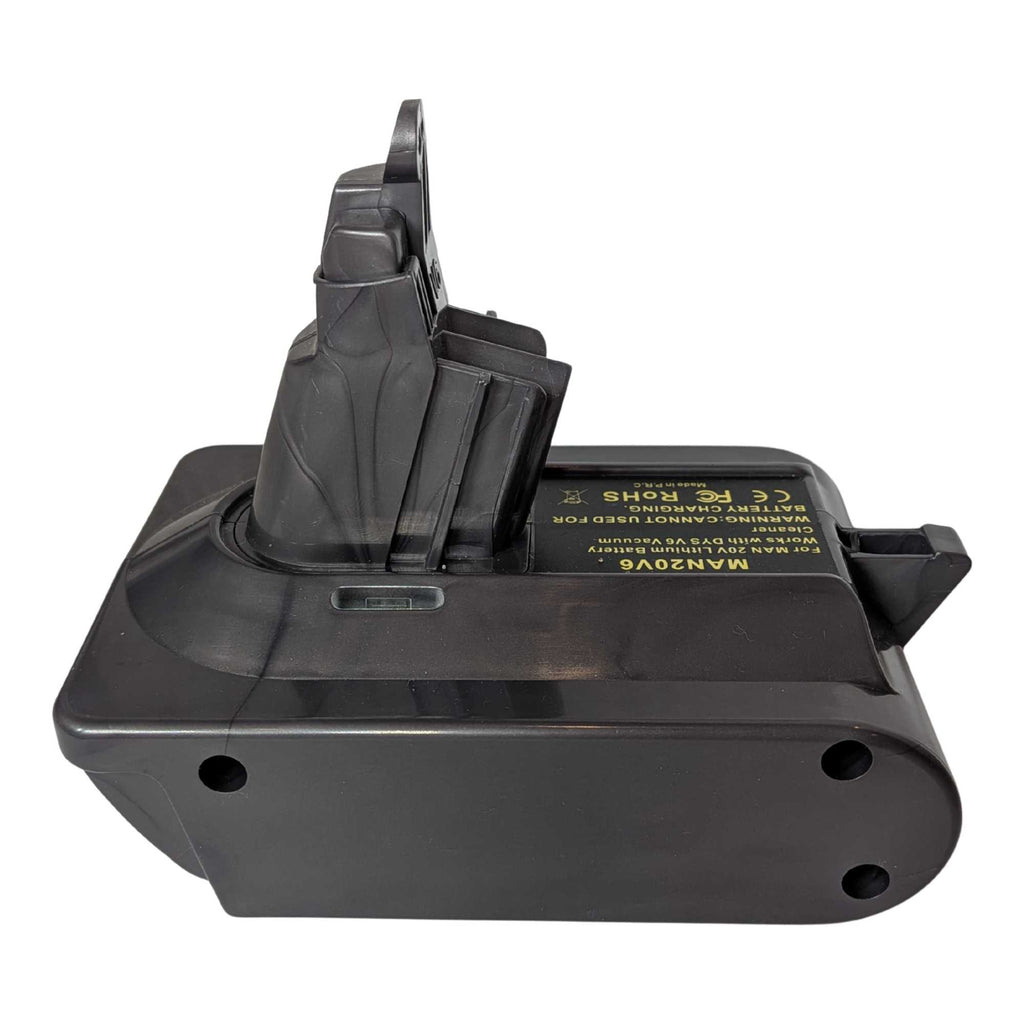 Stanley V20 to Dyson V6 battery adapter - side view with the Dyson tool-side stem upright, warning label along the top face